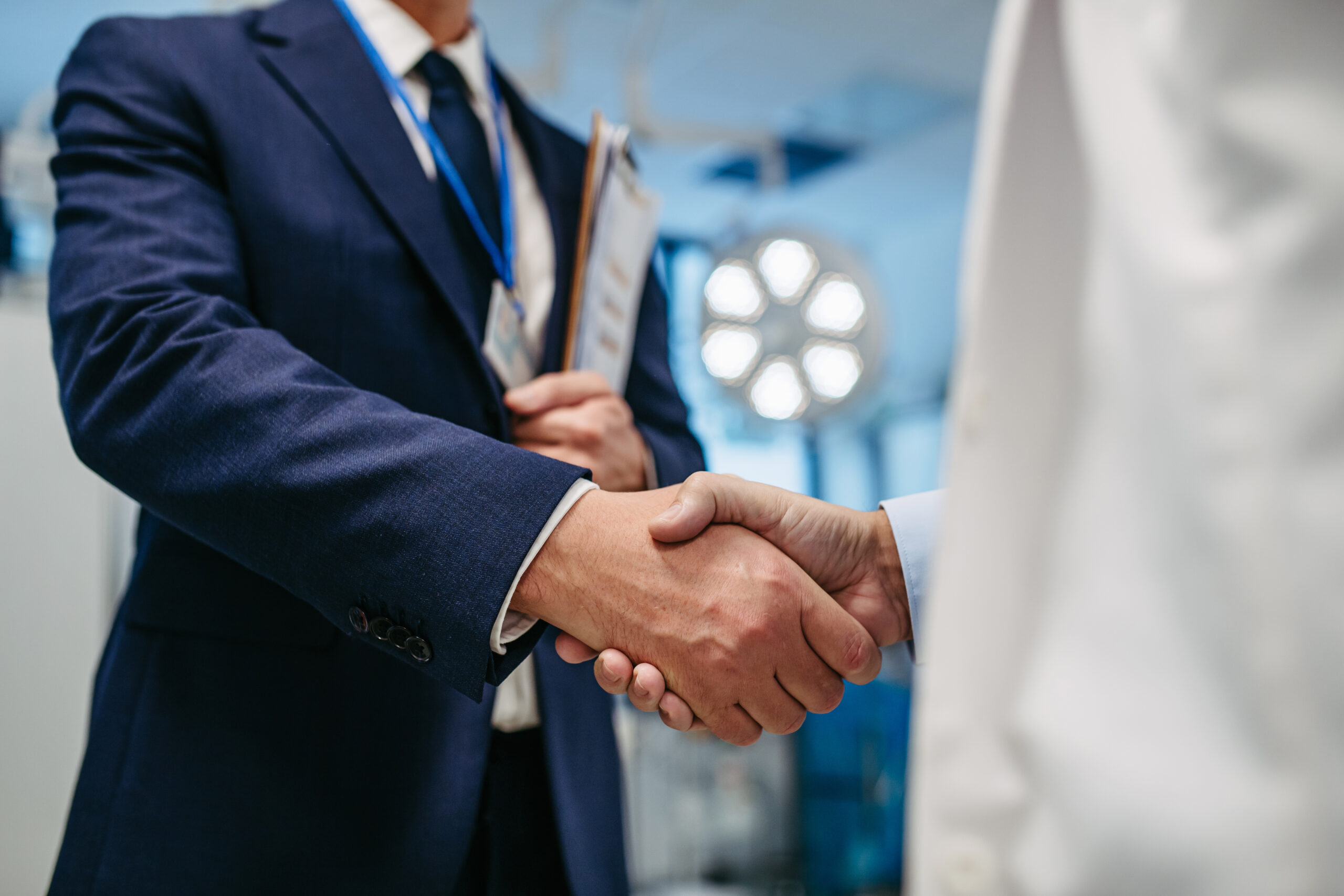 Pharmaceutical Sales Representatives shaking hands.