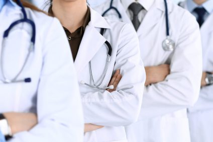 Group of doctors with arms crossed.